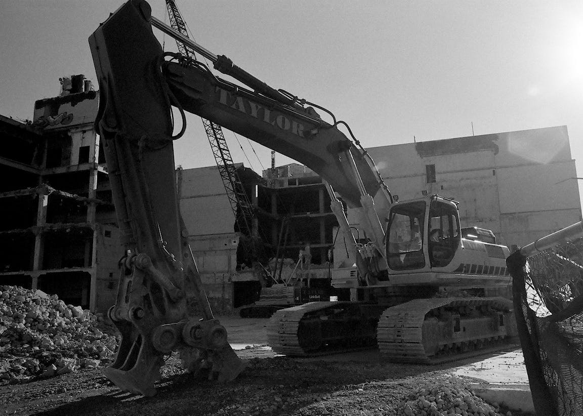 A black-and-white photo of a construction vehicle.